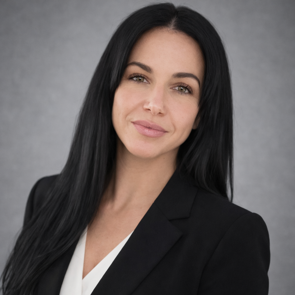 picture of a woman with dark hair and with a dark jacket on. Amy Markis